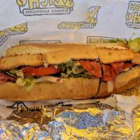 Grinder · Genoa Salami, Pepperoni, Spicy Capicola, Provolone, Lettuce, Tomatoes, Red Onions, Oil & Vin...