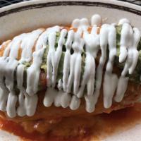 Burrito Suizo · Topped with our homemade ranchero sauce, melted cheese, guacamole and crema.
