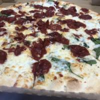 White Pizza · Ricotta cheese, spinach, garlic and mozzarella cheese, and pecorino Romano.