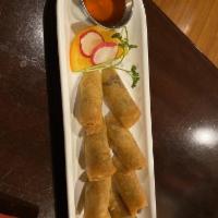 Crispy Spring Rolls · Stuffed with cabbages, carrots and vermicelli, fried served with sweet and sour sauce.