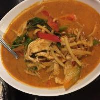Red Curry · Red coconut milk curry with bamboo shoots, bell peppers and basil. Spicy.