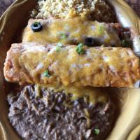 Enchilada · A soft corn tortilla stuffed with the above choice, topped with sauce and cheese and served ...