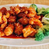 Sesame Chicken · Breaded and fried chicken with broccoli and a sweet and tangy red sauce.