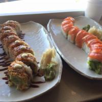 Orange Roll · Salmon and fish eggs on top with avocado, imitation crab, cucumber and spicy mayo.