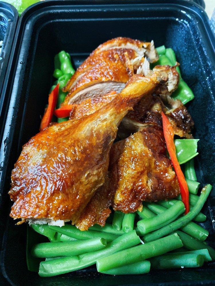 Chu Chee Duck · Crispy long island duck with chu chee sauce on a bed of steamed string bean, snow peas served with jasmine rice. Spicy.