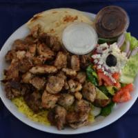 Gyro Plate · Shaved roast lamb and beef served over rice with a side Greek salad, pita and homemade tzatz...