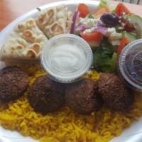 Falafel Plate · Fried ground chickpeas with herbs. Served over rice with a side Greek salad, pita and tzatzi...