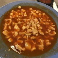 Menudo · Includes hominy and tripe. Comes with onion, cilantro, lemons, chili flakes and oregano on t...