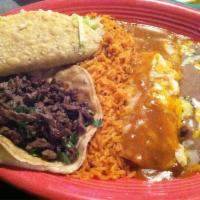 Carne Asada · Fine slices of sirloin cooked to perfection, garnished with shredded lettuce, tomatoes and g...