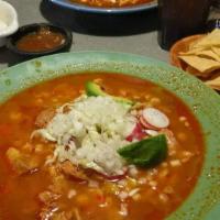 Pozole · Includes hominy, pork, and pata. Comes with cabbage, onions, radishes, lemon, and a spicy sa...