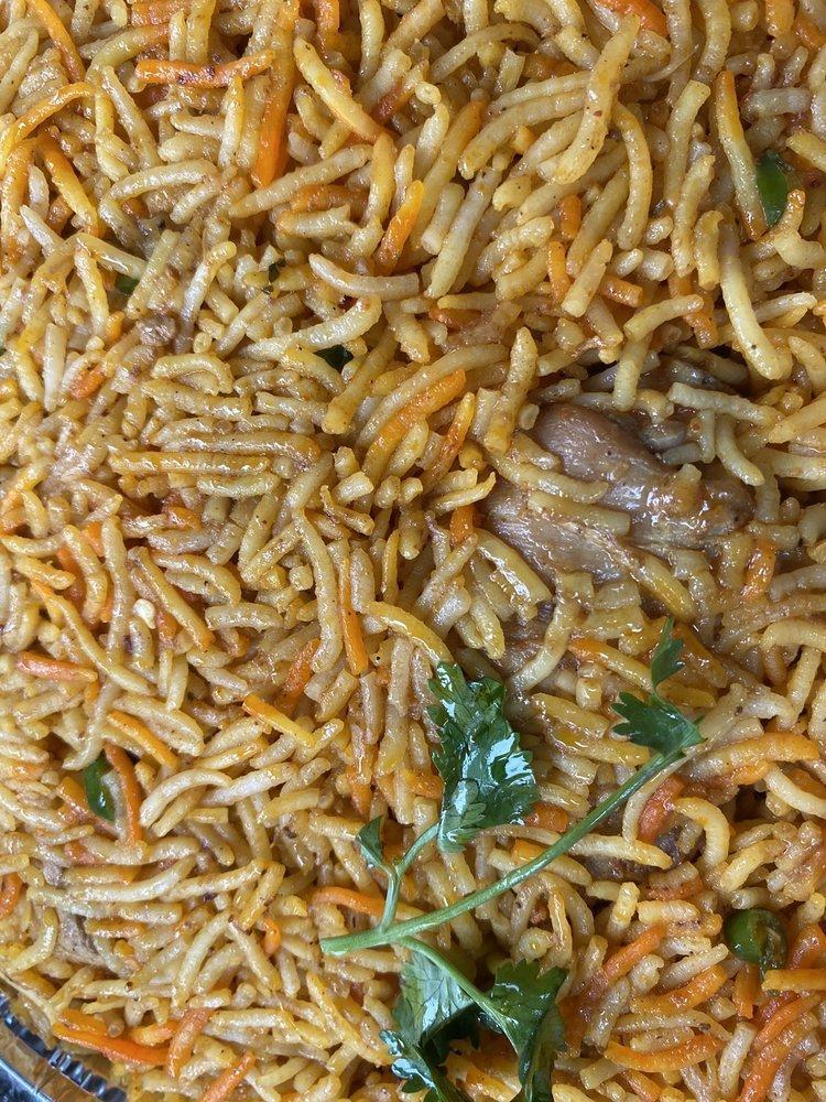 Chicken Biryani · Made with basmati rice, mixed with chicken and variety of spices.