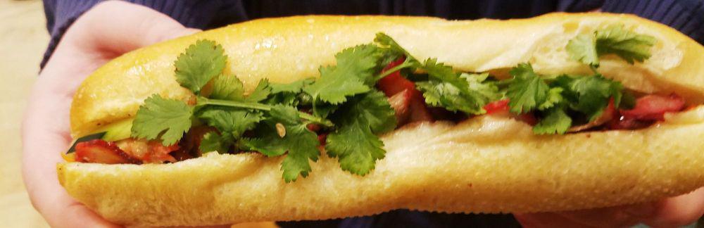 BBQ Pork Banh Mi · Chinese BBQ pork, house mayo, pickled carrots, cucumber, jalapeno, pepper, and cilantro.