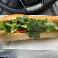 Vegetarian Banh Mi · Stir fried tofu with seasonings, house mayo, pickled carrots, cucumber, jalapeno, pepper, an...
