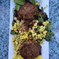 2 Crab Cakes · Served with black bean and corn salad over greens.