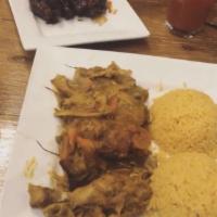 Curry Chicken · Bone-in chicken, marinated and cooked to perfection in authentic Jamaican curry. Served with...