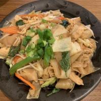 Drunken Noodles · Stir fried wide rice noodles, carrot, cabbage, bell peppers, bean sprout and basil.