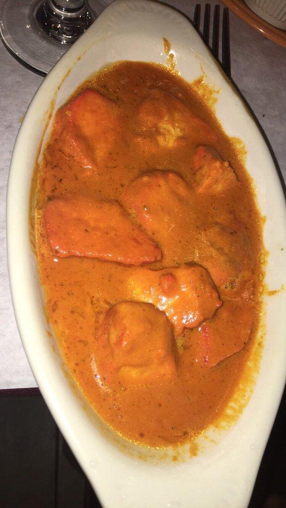 Chicken Tikka Masala · Boneless white meat chicken simmered in a tomato cream sauce with garlic, ginger, and bell pepper, comes with rice.