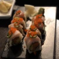 Daniela Roll · Spicy tuna, crunch and avocado roll topped with yellowtail, jalapeno slices and masago with ...