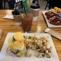Classic Eggs Benedict · 2 poached eggs, canadian bacon and hollandaise sauce, on english muffin with side of potatoes