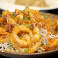 Fried Calamari · Fried calamari over crispy noodles, onions and Thai sweet chili sauce.