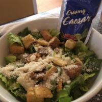 Caesar Salad · Romaine lettuce, croutons & romano cheese.