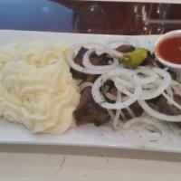 Lamb Kebab · Special marinated cubes of baby lamb. Served with toasted pita, onion and homemade sauce 