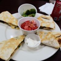 Quesadilla · Prepared with spinach and mixed cheese. Served with fresh salsa and guacamole.