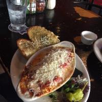 Lasagna · Italian sausage with ricotta cheese, oven baked with mozzarella, parmesan and red sauce. Hom...
