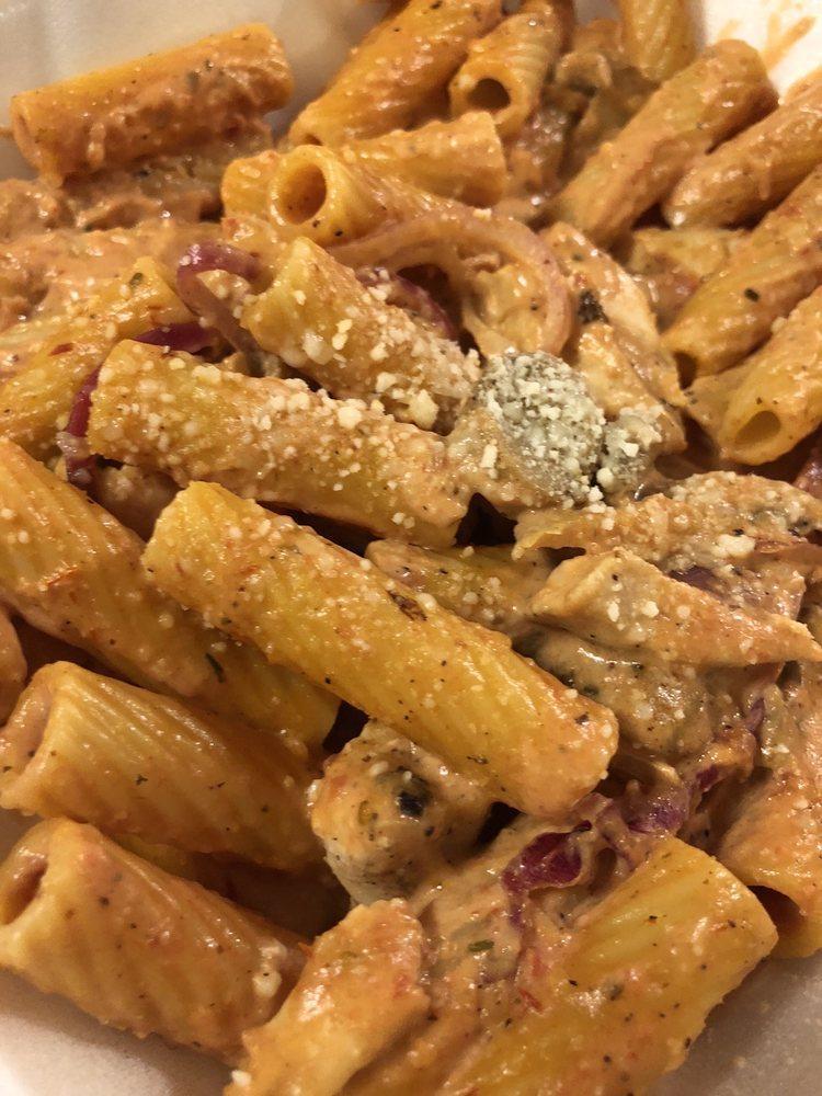 Chicken Riggies Pasta · Grilled chicken with hot peppers, red onions, mushrooms, and tomatoes in a cream sauce.