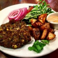 Chipotle Black Bean Burger · Homemade black bean patty formed with chipotle, jalapeno and bell peppers, carrots, corn, oa...