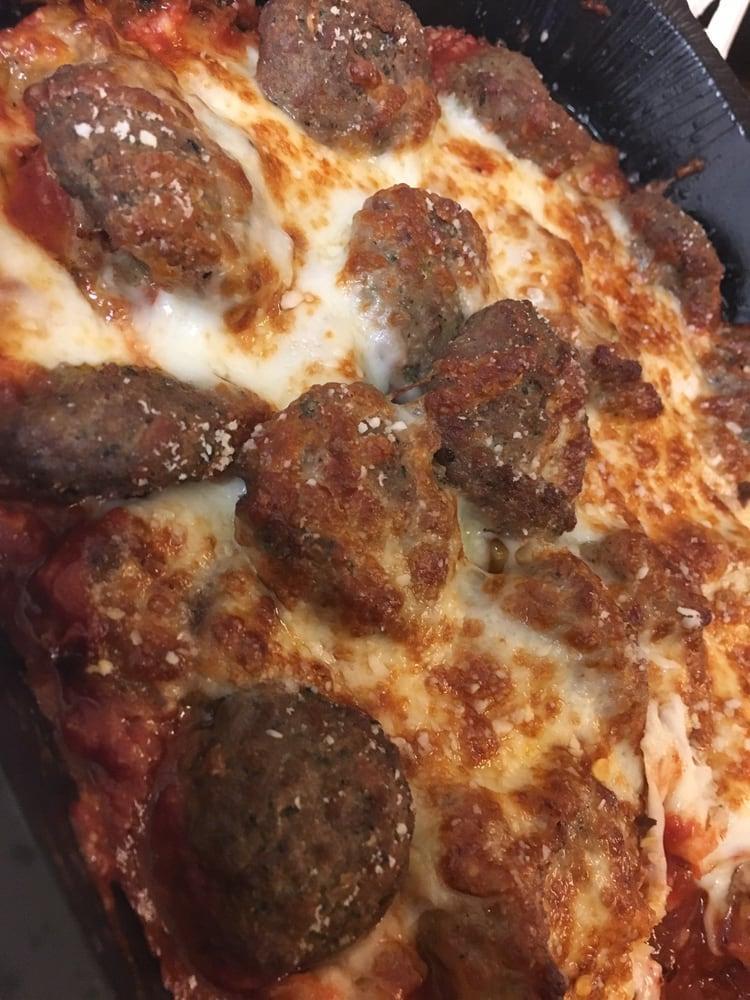 Meatball Bake · Marco's meatballs and sausages baked with our signature sauce and cheese blend.