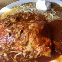 Big Red Burrito · This one is for our Husker fans a large ground beef and bean burrito smothered with red chil...