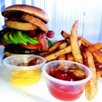 Hungry Lion Burger · Served with 2 meat patties, pickles, lettuce, tomato, avocado, two onion rings, bacon, chedd...