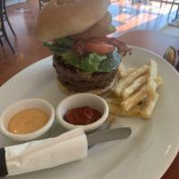 Hungry Lion King Burger · Served with 3 meat patties, pickles, lettuce, tomato, avocado, two onion rings, bacon, chedd...