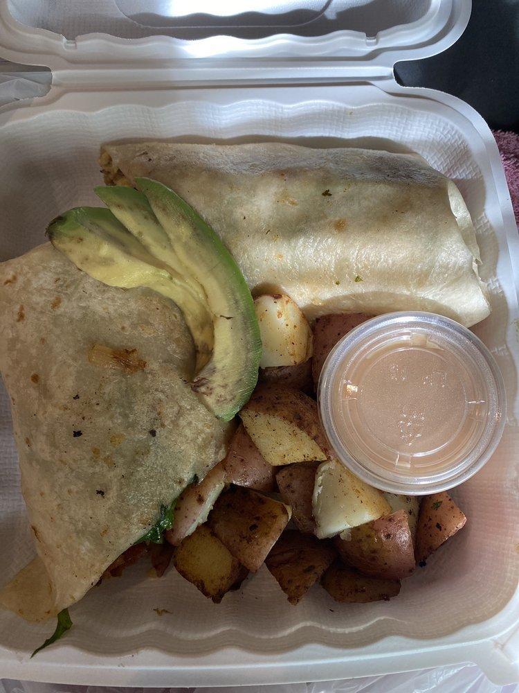 Hungry Lioness Green Wrap · Comes with eggs or egg whites, veggies, spinach, bacon, potatoes and cheese.