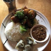 Veggie Momo Dumpling · Mustard greens, barley, tofu, and peanut sauce.