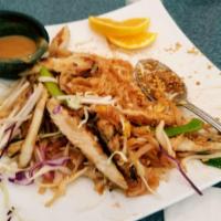 Pad Thai · Thin and flat rice noodles stir-fried with bean sprouts and green onion in our special Pad T...