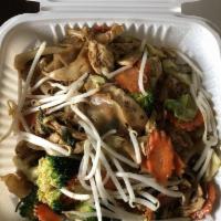 Pad Kee Mow · Wide and flat rice noodles stir-fried with broccoli, cabbage, carrots, onions, and basil in ...
