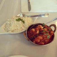 Chicken Vindaloo · Boneless chicken and potatoes cooked in a hot cherry sauce with herbs and spices. Served wit...