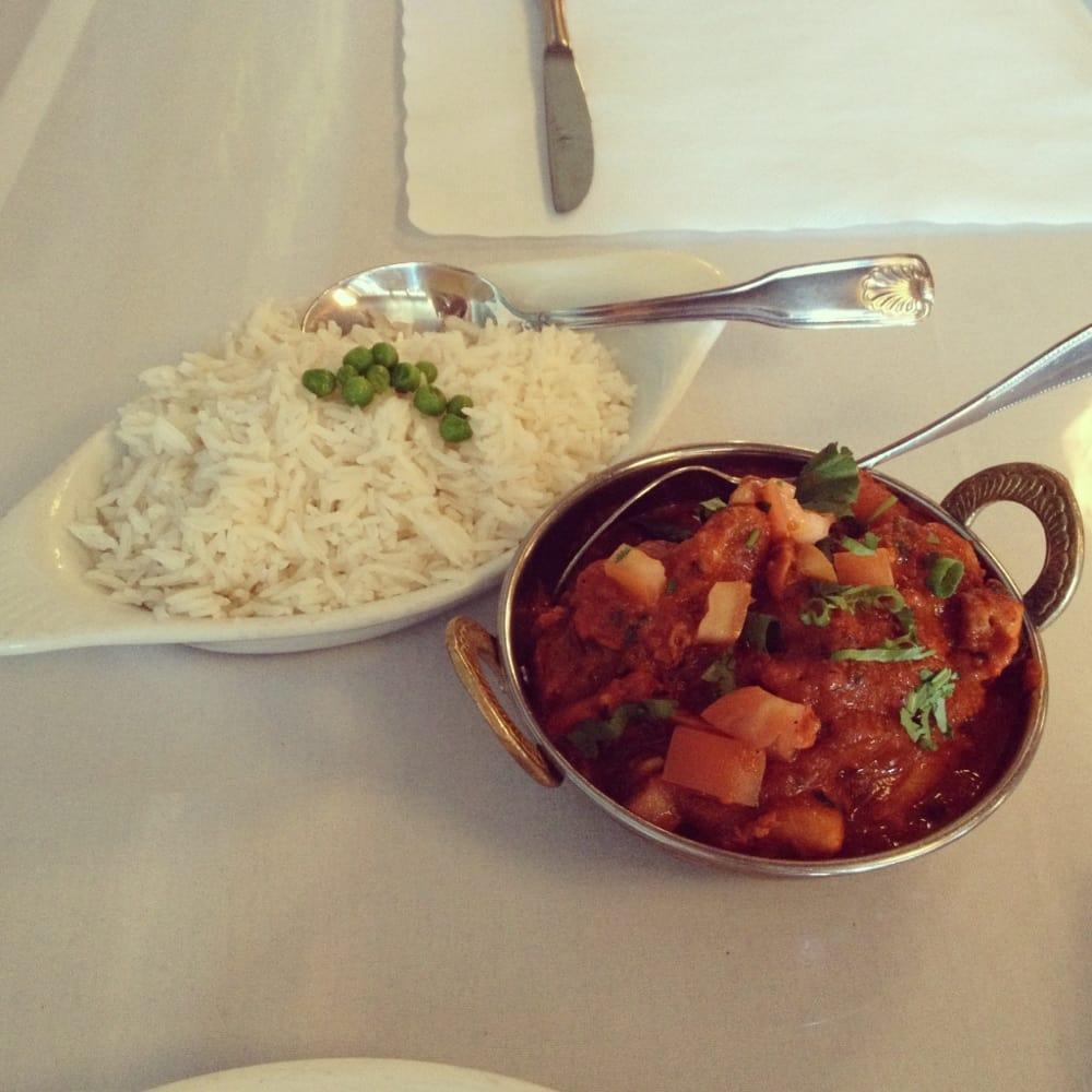 Chicken Vindaloo · Boneless chicken and potatoes cooked in a hot cherry sauce with herbs and spices. Served with basmati rice. THALIE comes with lentil soup, Naan Bread ,vegetable of the day, rice