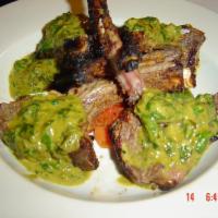 Kitchen Special · Rack of lamb marinated in yogurt, with pepper, lemon juice, light herbs and spices. Cooked i...