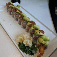 Tiger Roll · Shrimp tempura and crab salad topped with spicy tuna, avocado and eel sauce.