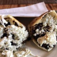 Arepa Pabellon · Shredded beef, black beans, grated white cheese and fried sweet plantains.