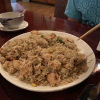 Chicken Fried Rice · Steamed rice stir-fried in a wok with chicken, onions, peas, green beans, carrots and corn.