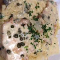 Chicken Piccata · Butterflied breast of chicken lightly dusted, pan seared & served in a light lemon caper but...