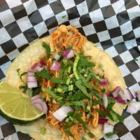 Tinga Taco · Pulled chicken, onion, cilantro and lime.