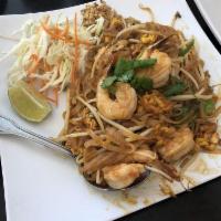 Pad Thai · Pan fried thin rice noodles served with bean sprout, carrot, cabbage and crushed peanuts.