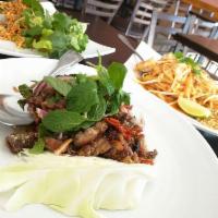 Larb · Served with your choice of meat and red onion, cilantro and crushed roasted rice in chili li...