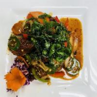 Basil Duck · Crispy duck topped with mushroom, carrot, onion, bell pepper, and scallion with Thai chili p...