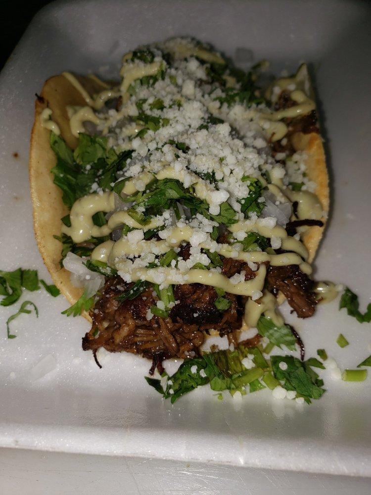 Brisket Taco · Smoked beef brisket seasoned with Dave's rub, topped with fresh onions, cilantro, cotija cheese and a creamy cilantro sauce